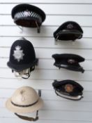 Four Gloucestershire Fire Service helmets and caps including a WW2 or similar steel example,