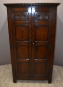 Carved oak cupboard believed by vendor to be Waring and Gillow, W99 x D52 x H175cm