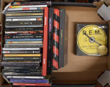 A collection of CDs including box sets, mostly U2 and Faith No More