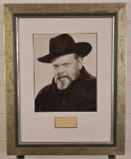 Orson Wells clipped signature, framed with a photograph of the director / actor, overall size 49 x