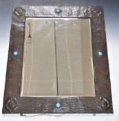 Arts and Crafts mirror, possibly Liberty, with applied Ruskin or similar cabochons, 69 x 79cm