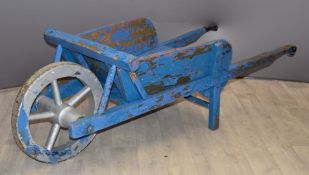 Victorian or early 20thC wooden wheelbarrow with metal wheel rim, length 160cm