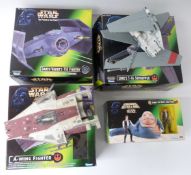 Four Kenner Star Wars Power of the Force model vehicles comprising Darth Vader's Tie Fighter, Luke's
