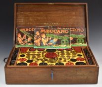 Meccano Outfit 10 with green and red parts including gears, tyres etc in original fitted wooden