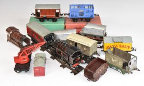 Twelve Hornby 0 gauge tinplate locomotives, coaches, wagons and vans, including clockwork