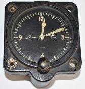 Smiths 5 ACA aircraft cockpit clock, serial number 677/50, with Fenns Farnborough label to top,