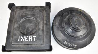 Two inert training mines, one a circular example marked 'TMRP 6/037' 29cm in diameter the other