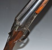 Baikal IJ-58 12 bore side by side ejector shotgun with heavy engraving of stag heads to the locks,