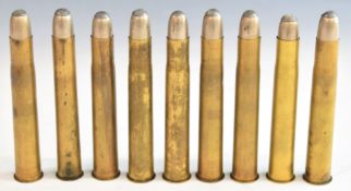 Nine deactivated .500-450 brass cased big game rifle cartridges.