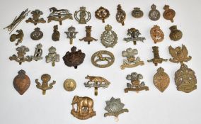 Approximately thirty British Cavalry and Yeomanry metal cap badges including 4th Royal Irish Dragoon
