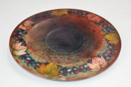 Moorcroft teapot stand decorated in the flambé leaf and berry pattern, diameter 19.5cm