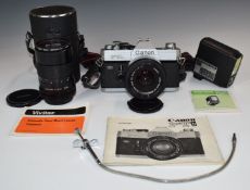 Canon FTb SLR camera with 50mm 1:1.8 lens, further Vivitar 135mm 1:2.8 lens, flash gun, manual etc