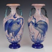Enoch Wood pair of twin handled pedestal vases decorated with herons, H31cm