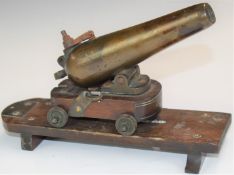Bronze signalling or desk cannon with six inch graduated barrel stamped '1851' raised on wooden
