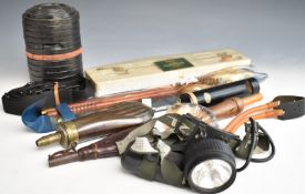 A collection of gun and shooting accessories including a copper and brass powder flask, a leather