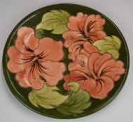 Moorcroft charger decorated in the Hibiscus pattern, diameter 26cm