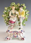 A 19thC porcelain figure of sweethearts, gold anchor mark verso