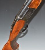 Baikal 12 bore over and under shotgun with engraved scenes of birds to the locks, engraved top