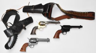 Three replica Colt single action Army .45 and similar revolvers together with various holsters,