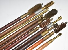 Ten vintage shotgun cleaning rods including one with brass shaft and turned wooden handle.