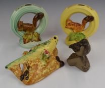 Two Burleigh Ware squirrel flower frogs, budgie wall pocket and a Poole pottery bird, tallest 20cm