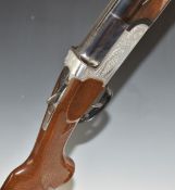 Midland 12 bore over and under shotgun with engraved lock, underside, trigger guard, top plate and