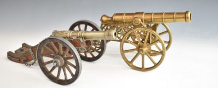 Two model cannon, one of bronze or brass construction, the other with wooden carriage bearing plaque