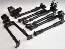 Four various rifle bi-pods together with an illuminated red/ green dot rifle sight.