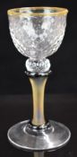 Paul Barcroft British studio glass goblet with twisted bowl, applied rim and matt stem, 18.5cm tall.