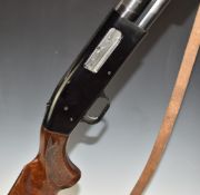 Mossburg 12 bore 3-shot pump-action shotgun with chequered semi-pistol grip and forend, leather