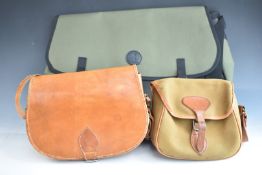 John Nickerson canvas game bag together with two shotgun cartridge bags, one leather with external