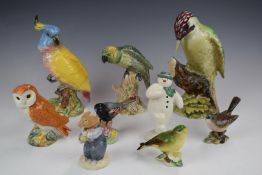 Four Beswick birds including woodpecker and cockatoo, Royal Doulton Snowman, Brambly Hedge etc,