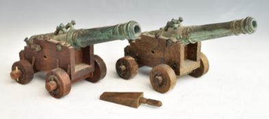 Pair of model cannon with cast bronze or similar barrels bearing date 1626 and wooden four wheel