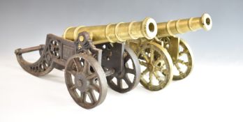 Two model cannon, one with cast iron carriage, length 46cm