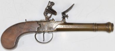 Flintlock pistol with line engraved brass lock, thumb slide safety, walnut grip and 5 inch smooth