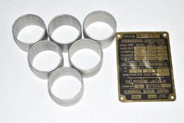 Merlin II engine identification plate together with six aluminium napkin rings, possibly constructed