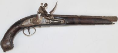 Eastern flintlock pistol with engraved lock, trigger guard and butt plate, carved grip and 10.5 inch