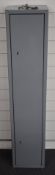 Metal shotgun or rifle cabinet or safe fitted for four guns, with two sets of keys, 130 x 27 x 20cm.