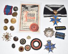 Copy and original Imperial German insignia including Blue Max, Colonial Services badge etc