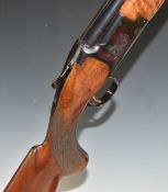 Miroku 12 bore over and under ejector shotgun with engraved lock, chequered semi-pistol grip and