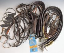 Large quantity of equestrian stirrups, bridles, bits, girth straps and other tack, some items appear