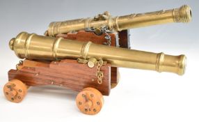 Two model cannon with brass or similar barrels and wooden carriages, one marked El Tigre 1797,