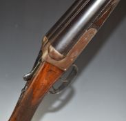 Cogswell & Harrison 12 bore side by side shotgun with named locks, chequered grip and forend, double