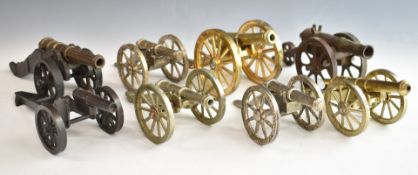 Eight model cannon with metal carriages, one with GR cypher to barrel, length of longest 20.5cm