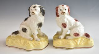 A pair of 19thC porcelain spaniels, H13cm