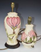 Two Moorcroft table lamps decorated in the Magnolia pattern, tallest 38cm