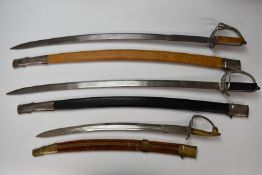 Three souvenir/display swords 'Made in India' with scabbards, longest blade 76cm. PLEASE NOTE ALL