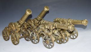 Set of four model brass cannon with dragon decoration to the four wheeled carriages, overall
