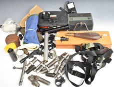 A collection of gun and shooting accessories including powder flasks with embossed decoration, re-