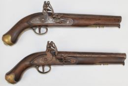 A pair of flintlock pistols each with lock stamped 'Tower' and with crown over 'GR' cypher, line